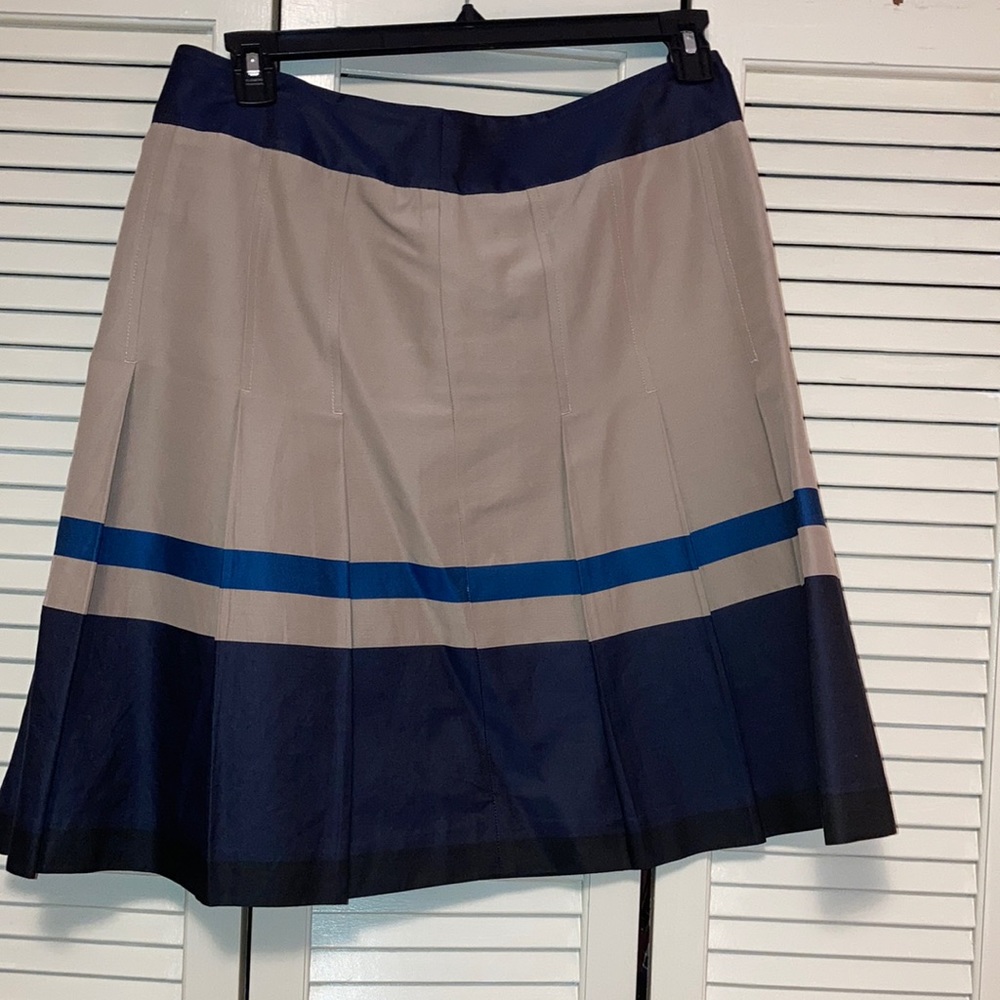 Ann Taylor pleated skirt, size 10. Tan, navy blue, and royal blue.